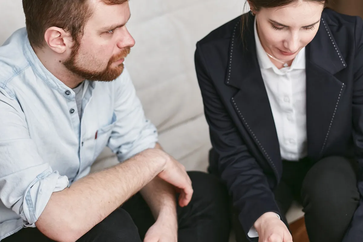 An adviser pointing out a passage in a contract to a client